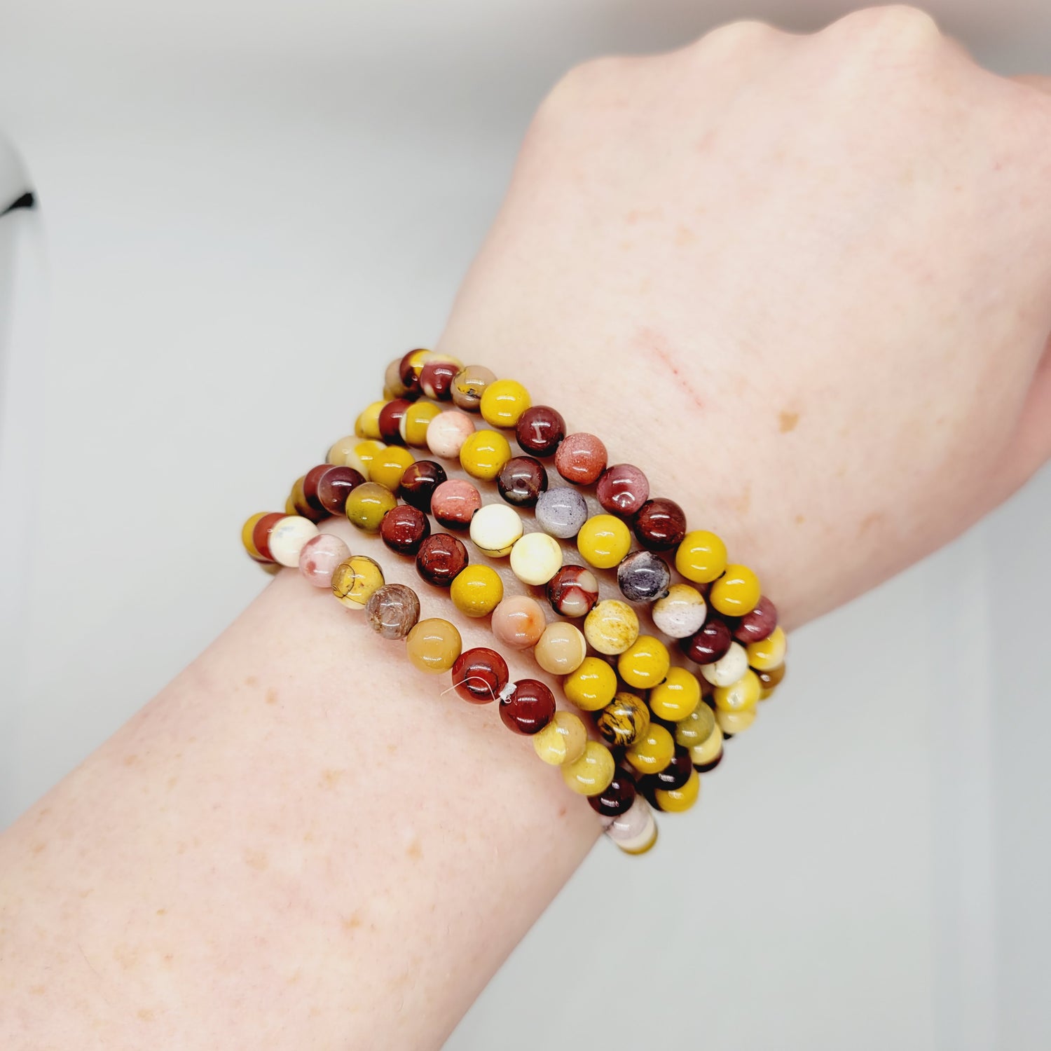 Mookite stone bracelet by Olive Coeus featuring vibrant, natural beads with a boho and metaphysical Reiki-inspired design.