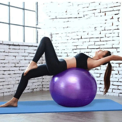Yellow Pandora home exercise yoga ball, fitness equipment for core workouts, shown on a clean gym floor with a neutral background.