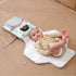 Maroon Chronos folding travel changing pad for babies, portable and soft surface for changing infants on the go.