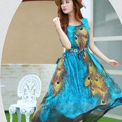 Yellow Pandora sleeveless peacock-themed long dress with intricate feather patterns and flowing fabric.