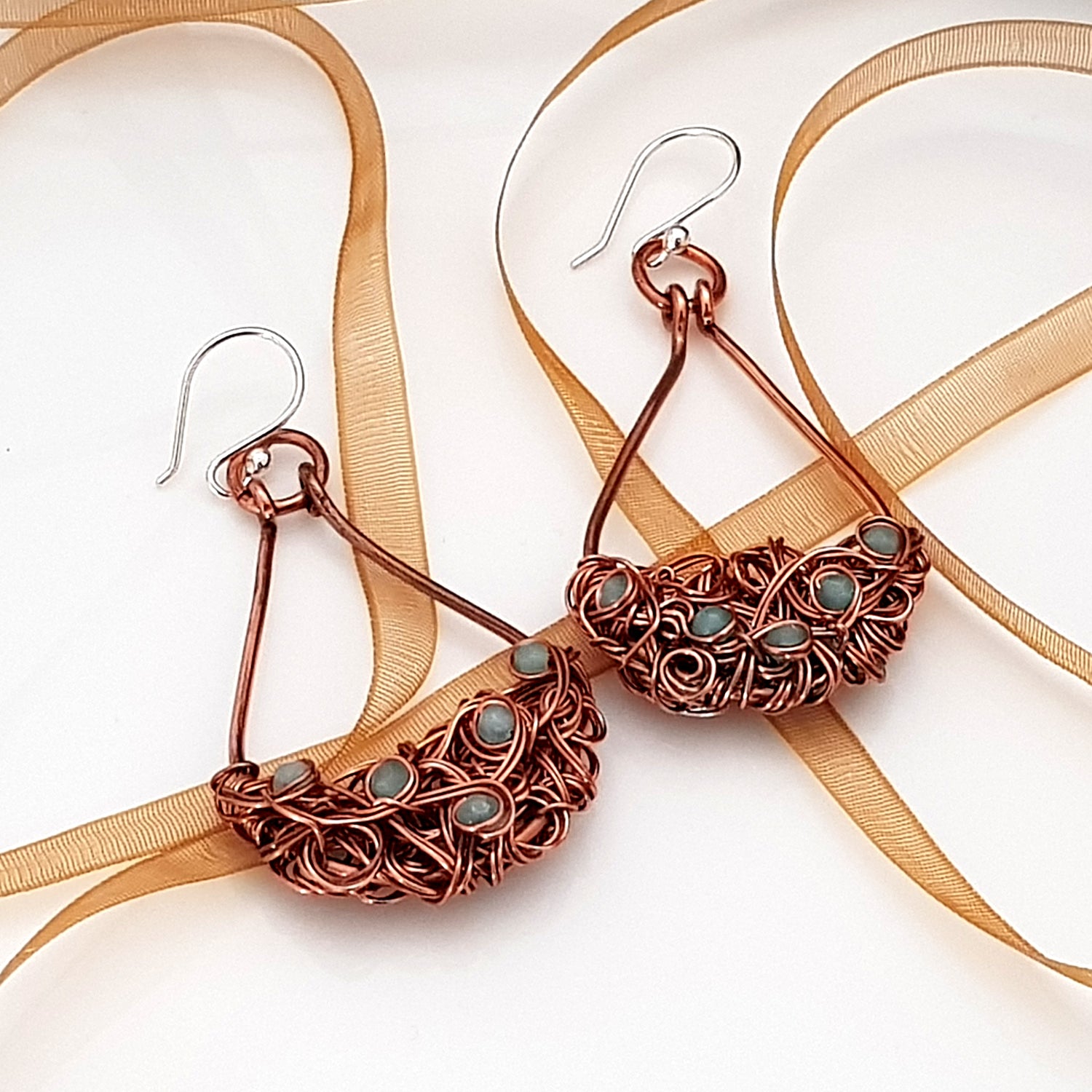 Copper teardrop tangled earrings by Maroon Smudge featuring intricate, dangling design with a warm, metallic finish.