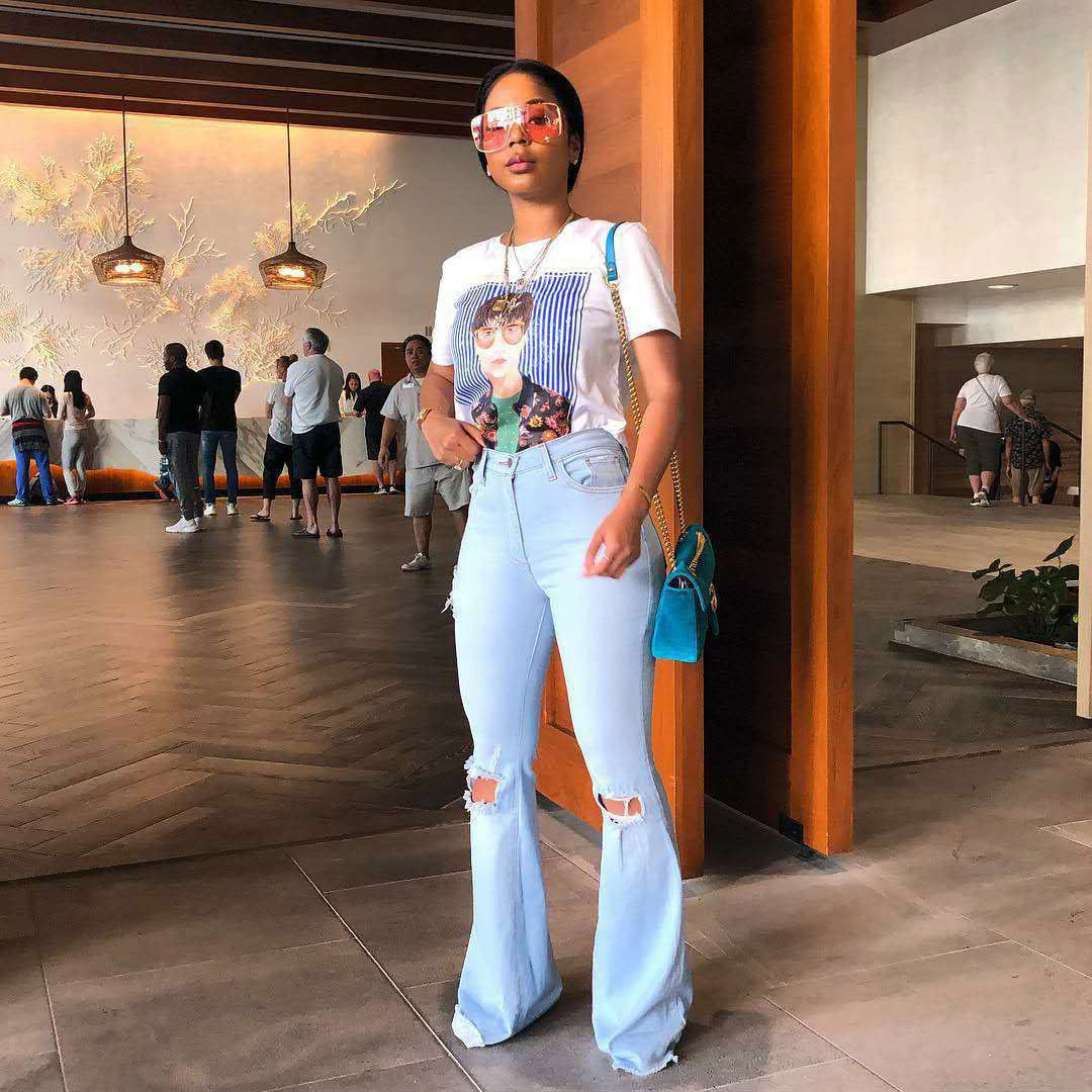 Vintage denim jeans for women by Carmine Juneberry, showing classic fit and distressed details in a stylish casual look.
