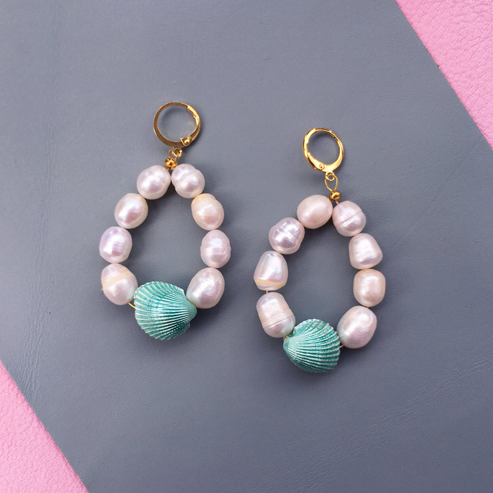 Yellow Athena Candy Shell Pearl Earrings featuring smooth, round pearl drops with a delicate gold-tone setting.