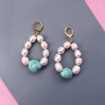 Yellow Athena Candy Shell Pearl Earrings featuring smooth, round pearl drops with a delicate gold-tone setting.