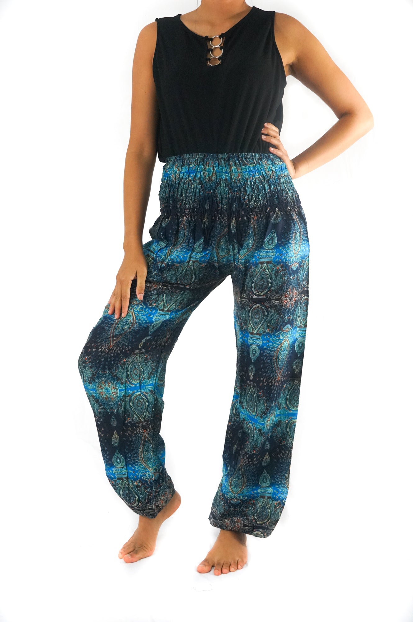 Turquoise paisley harem pants by Tan Smokey featuring a boho hippie style with relaxed fit and intricate paisley pattern.