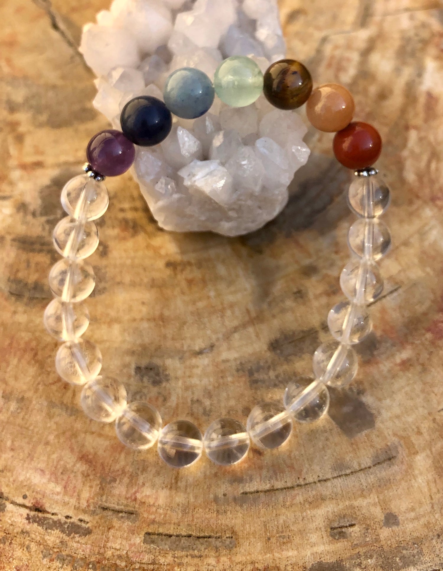 Handmade Chakra and Crystal Quartz stretch bracelet with natural stones from Violet Chaos, featuring colorful beads and healing crystals.