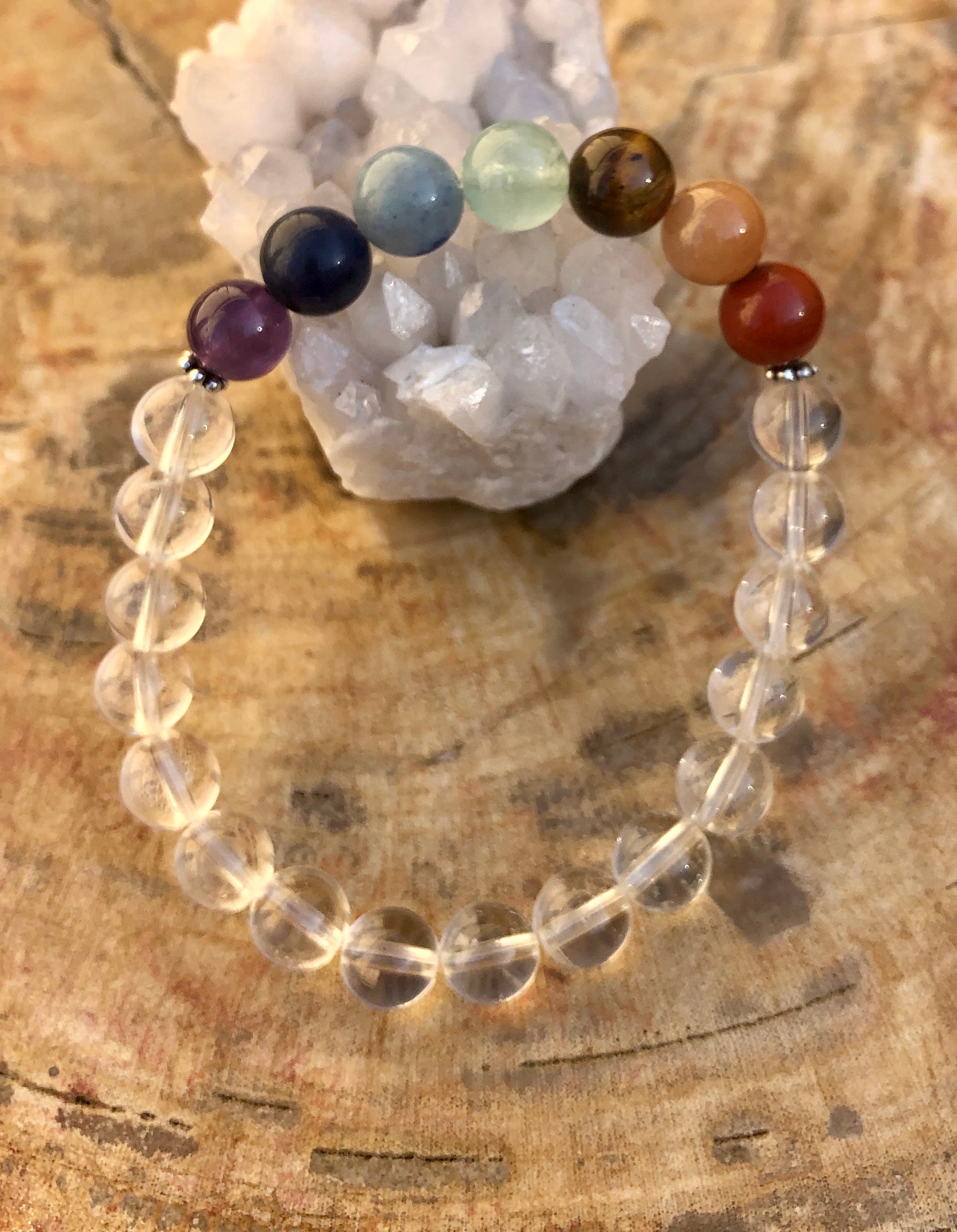 Handmade Chakra and Crystal Quartz stretch bracelet with natural stones from Violet Chaos, featuring colorful beads and healing crystals.