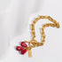 Black Felix Pomegranate Seeds bracelet featuring vibrant red bead strands and a stylish, adjustable bracelet design.