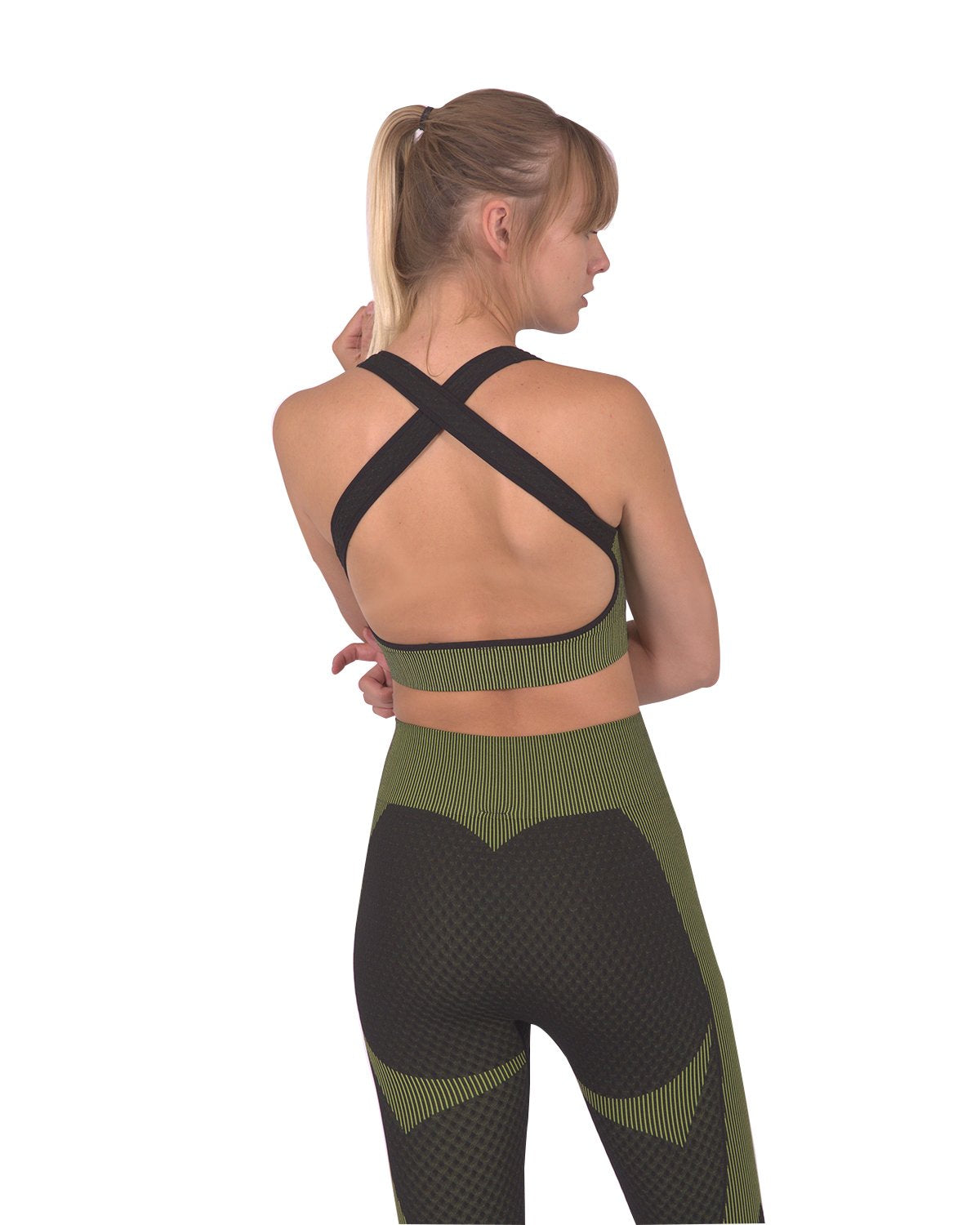 Lazurite Trois seamless sports bra in black with green accents, activewear designed for comfort and support during workouts.