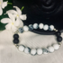 Howlite and black onyx stretch bracelet with silver spacers, featuring smooth white and black beads, by Tan Saffron.