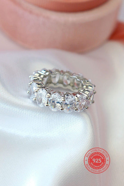 925 silver oval cubic zirconia band ring with sparkling stones, crafted by Ultramarine Birch, showcasing elegant jewelry design.