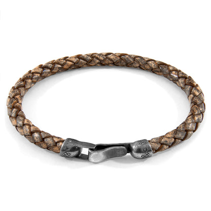 Taupe grey Skye silver and braided leather bracelet by Magenta Sooty with silver accents and woven leather details.