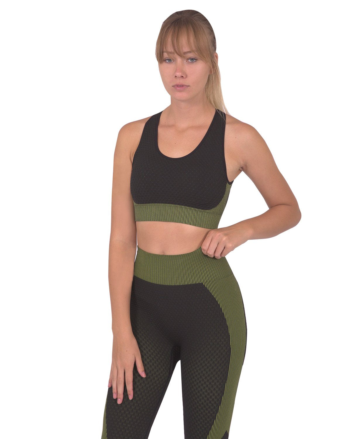 Lazurite Trois seamless black and green sports bra for activewear, with a snug fit and breathable fabric.