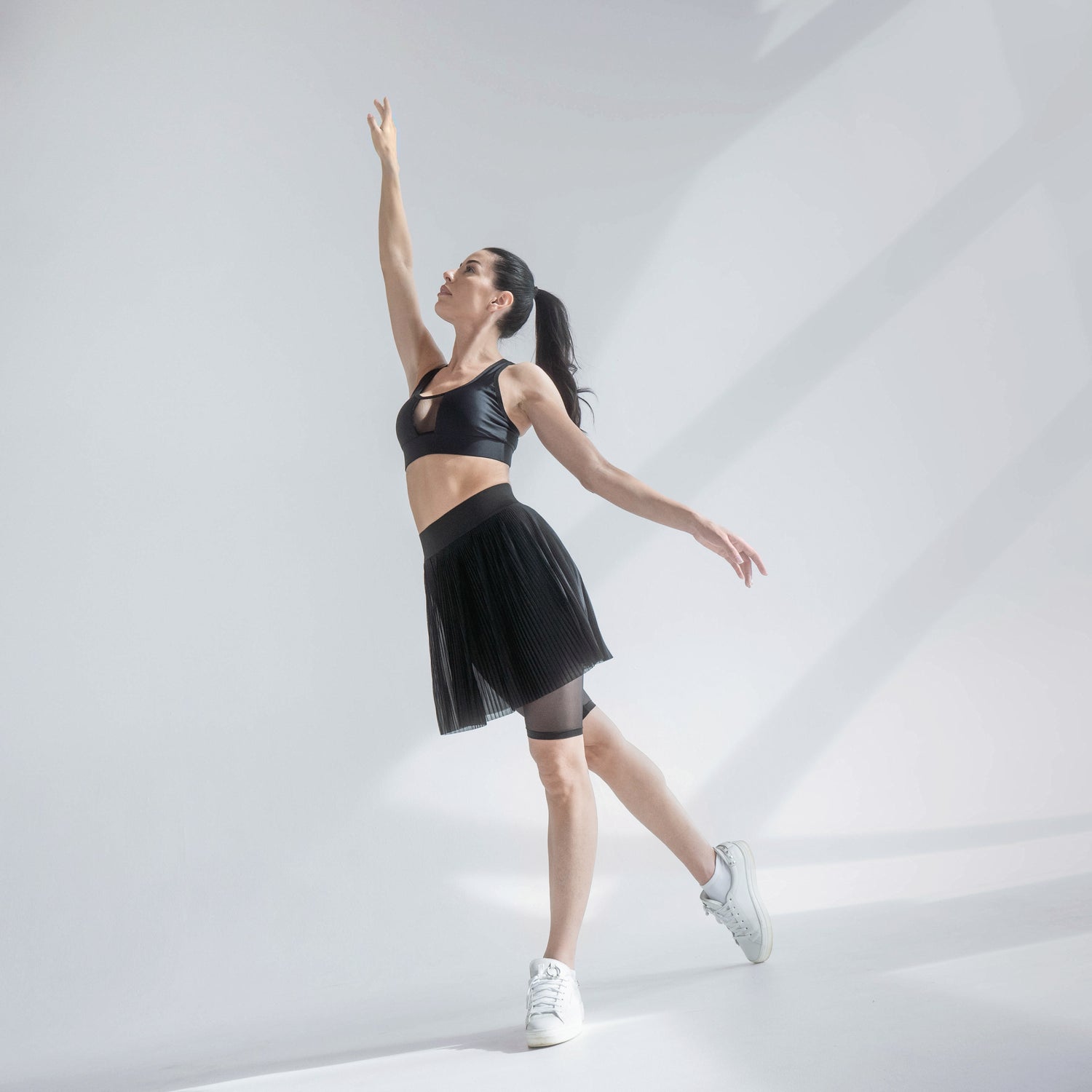 Indigo Thalassa MINI PLESSY mesh skirt featuring a fitted design with a stylish, see-through mesh fabric.