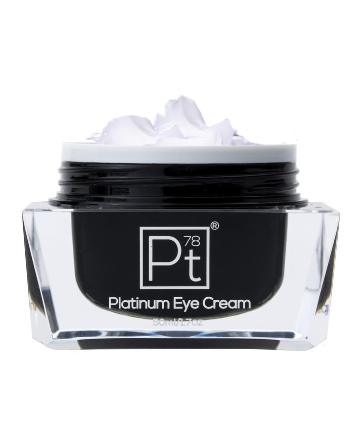 Amaranth Daisy Platinum Eye Cream in a sleek jar, showcasing a luxurious skincare product for brightening and reducing puffiness around the eyes.