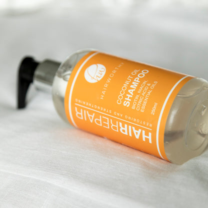 Black Sugarplum Hairworthy Hairrepair Shampoo bottle for hair repair and cleansing, with a sleek design and clear product label.