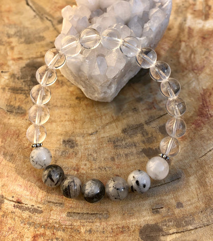 Black tourmaline and crystal quartz stretch bracelet featuring genuine crystals, designed by Violet Chaos for protective and healing energy.