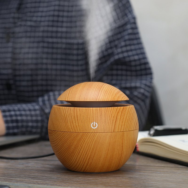 Fuchsia Molly wood grain desktop humidifier for home and garden, featuring a sleek design and adjustable mist output.