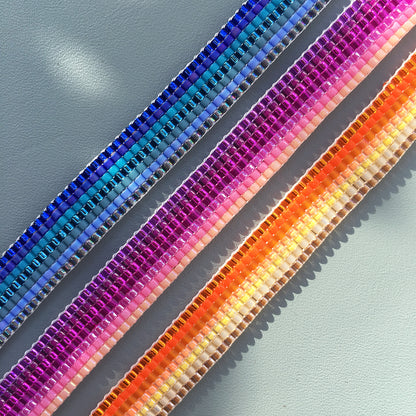 Yellow Athena Skinny Ombre Bracelet featuring blue, pink, and orange gradient colors, stylish and vibrant accessory for wrist.