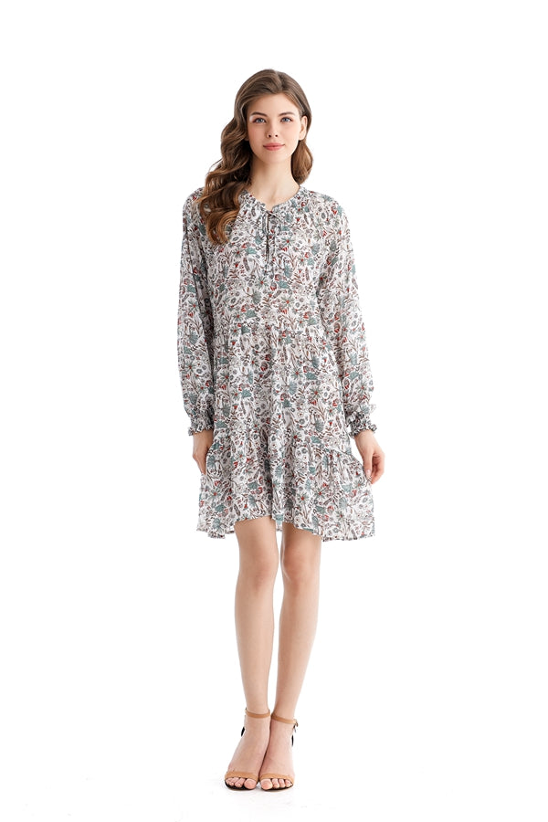 Teal Simba chiffon dress with loose waist and printed design, showcasing elegant, flowing fabric for a stylish, comfortable look.
