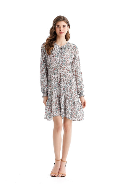 Teal Simba chiffon dress with loose waist and printed design, showcasing elegant, flowing fabric for a stylish, comfortable look.