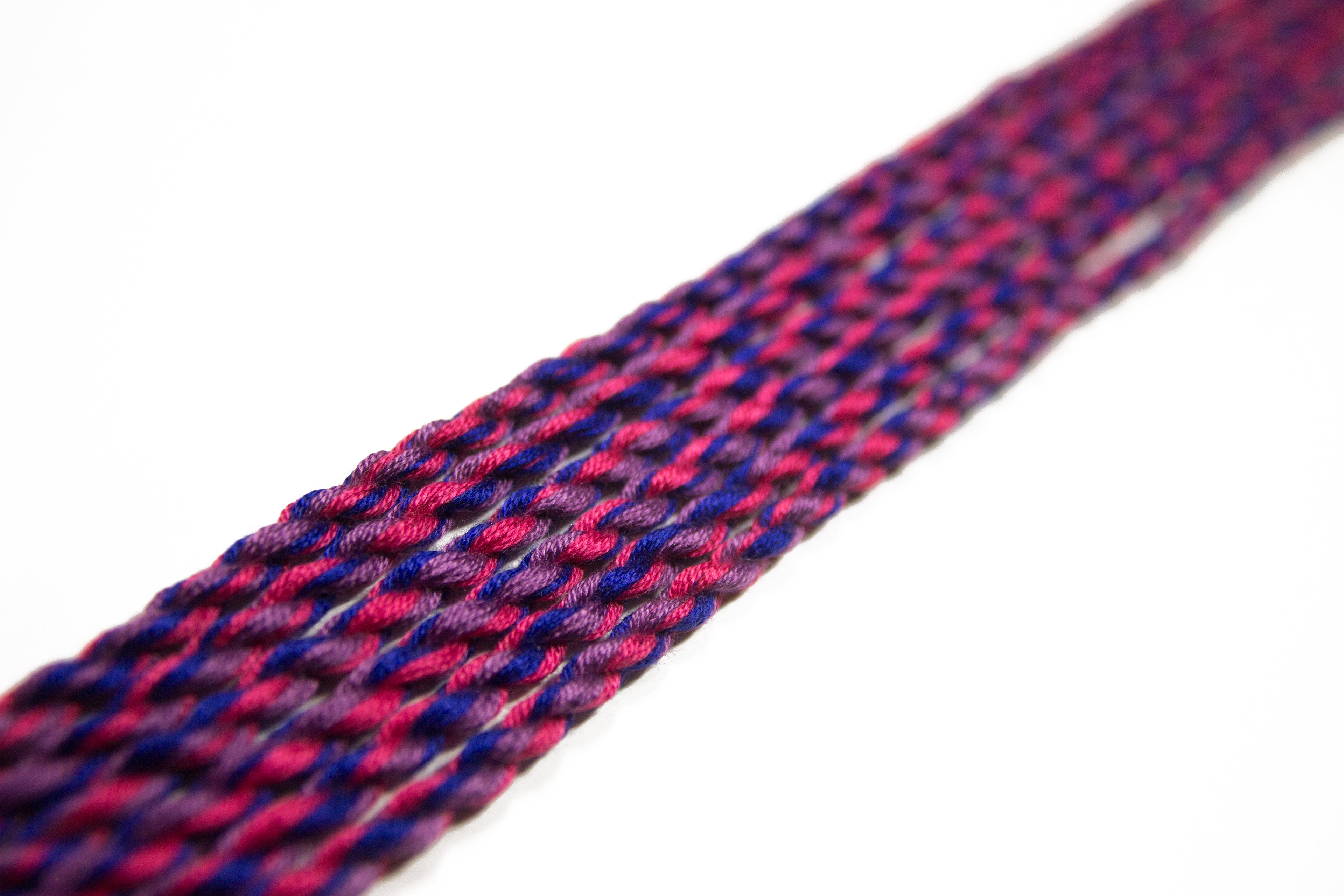 Handmade cotton bisexual friendship bracelet with LGBTQ pride colors from Rose Erebus, featuring vibrant rainbow and bi pride symbols.