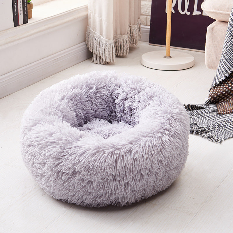 Super soft long plush Teal Simba pet bed with cushioned sides and cozy interior for calming comfort.