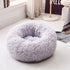 Super soft long plush Teal Simba pet bed with cushioned sides and cozy interior for calming comfort.