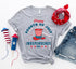 Red, white, and blue Happy Fourth of July T-shirt by Agate featuring patriotic graphics on soft cotton fabric.