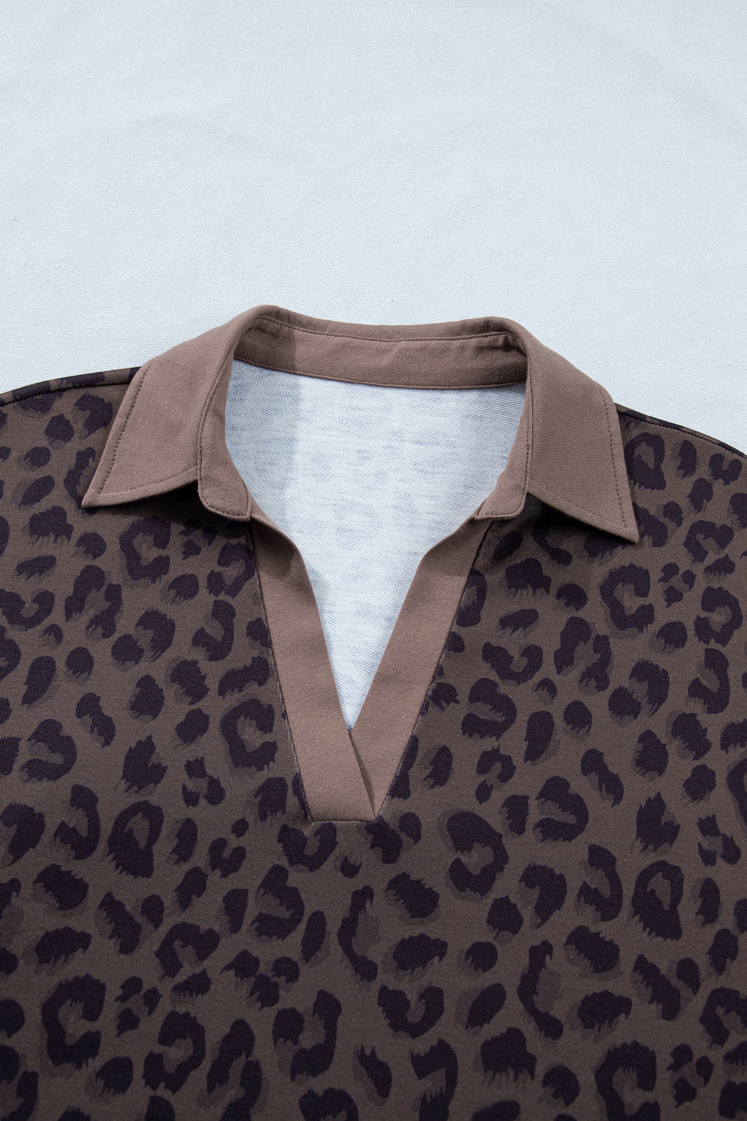 Leopard print collared v-neck top and matching shorts set by Byzantium Bay, styled for casual wear with a trendy look.