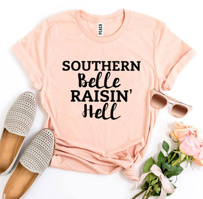 Southern Belle Raisin’ Hell T-shirt by Agate, featuring a stylish graphic design on a casual cotton T-shirt.