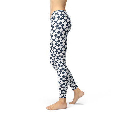 Women’s geometric blue tile leggings by Maroon Sooty featuring a bold, intricate tile pattern on stretchy fabric.