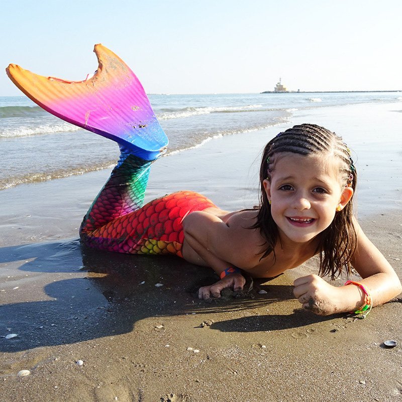Fuchsia Molly mermaid swimsuit towel featuring vibrant mermaid scale design and soft, absorbent fabric for beach or pool use.