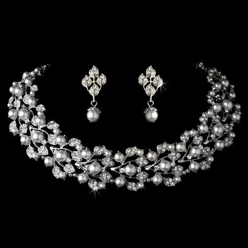 Elegant bridal wedding jewelry set by Olive Chaos featuring crystal, pearl necklace and matching earrings for special occasions.