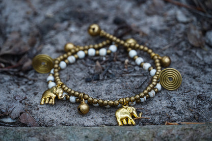 Tan Smokey Boho brass elephant bracelets featuring intricate elephant charm, layered design, and adjustable fit.