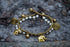 Tan Smokey Boho brass elephant bracelets featuring intricate elephant charm, layered design, and adjustable fit.