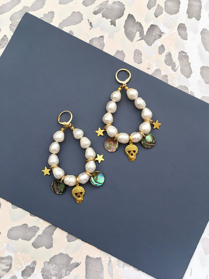 Yellow Athena Pearl Charm Earrings featuring elegant pearl drops and silver hooks for a sophisticated jewelry look.
