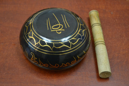 Handmade Nepal Tibetan brass singing bowl from Grey Aphrodite, used as a diffuser or candle holder, with intricate engraved details.