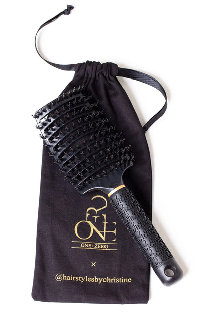 Black Burgundy Clover hair comb for haircare, with wide teeth and sleek design for detangling and styling hair.