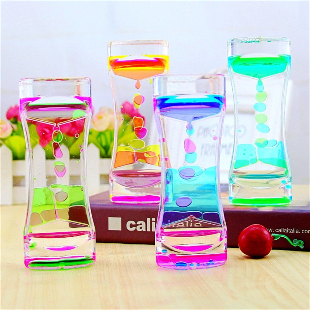 Colorful liquid sand hourglass timer from Teal Simba, decorative home decor piece for relaxation and anxiety relief.