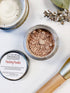 White Smokey Organic Finishing Powder Setting for makeup, translucent powder in a sleek compact, ideal for a matte finish.