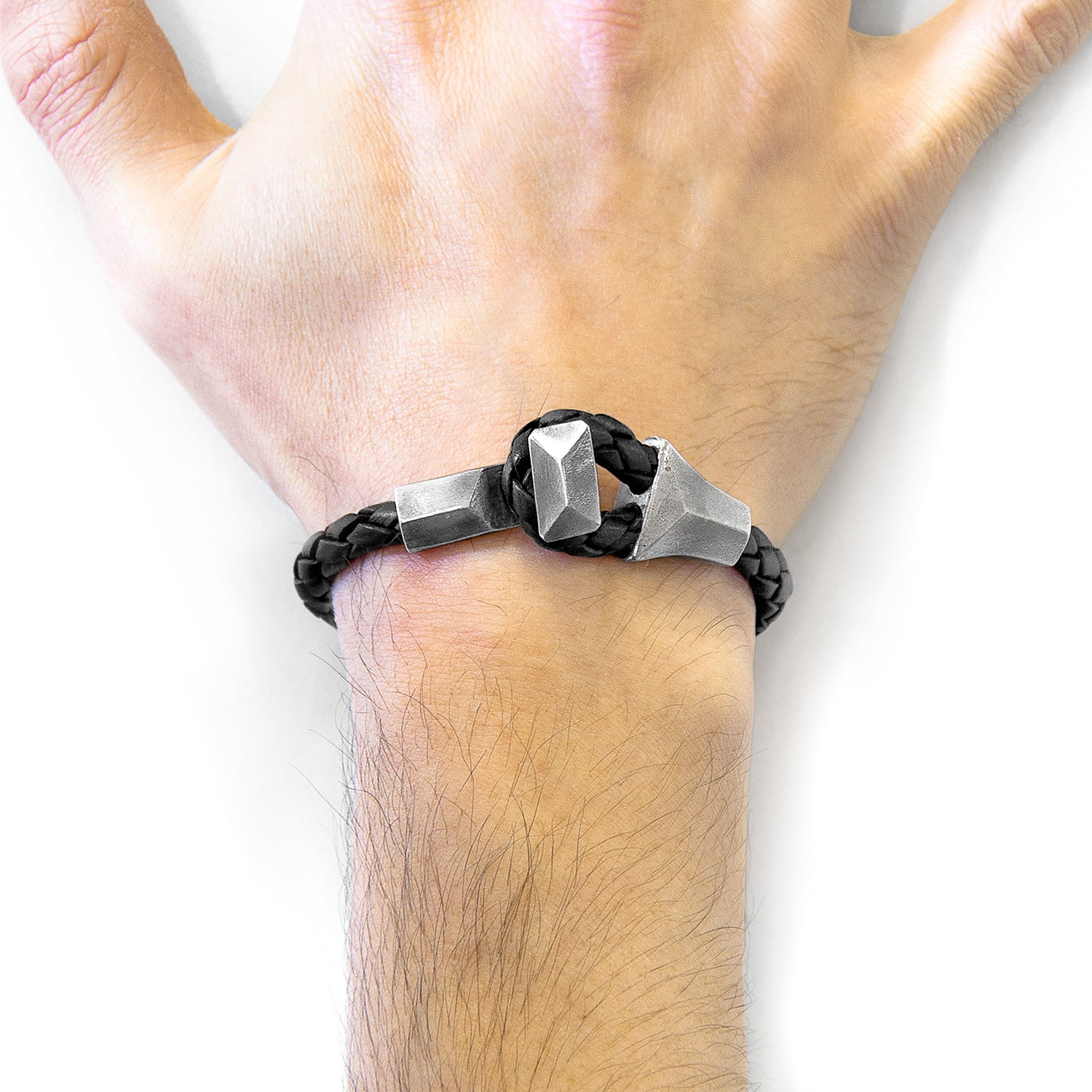 Midnight black Alderney silver and braided leather bracelet by Magenta Sooty showing intricate silver accents and textured leather braid.