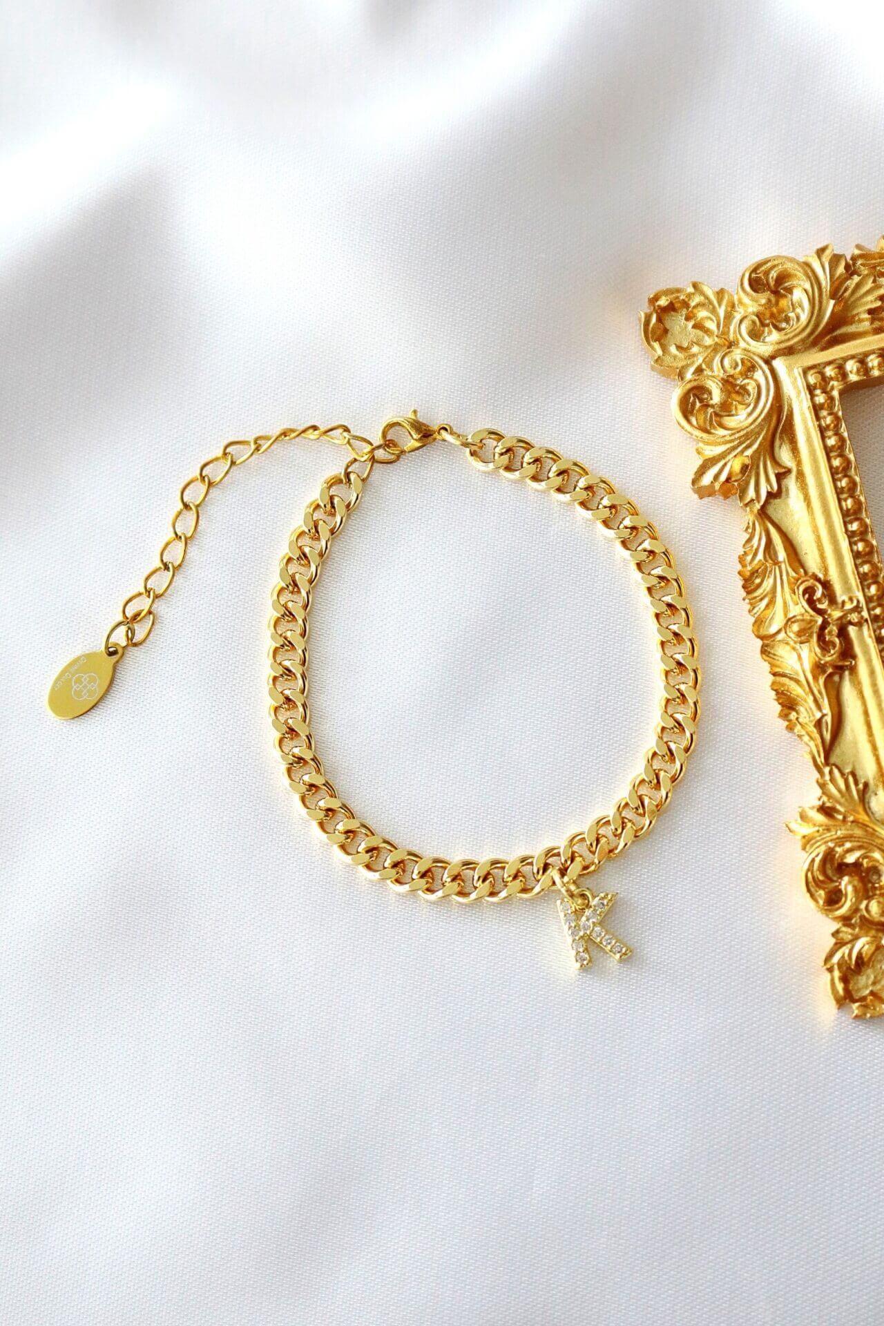 Ultramarine Birch Custom Initial 24K Gold Thick Cuban Chain Bracelet with personalized initial pendant, showcasing luxurious jewelry design.