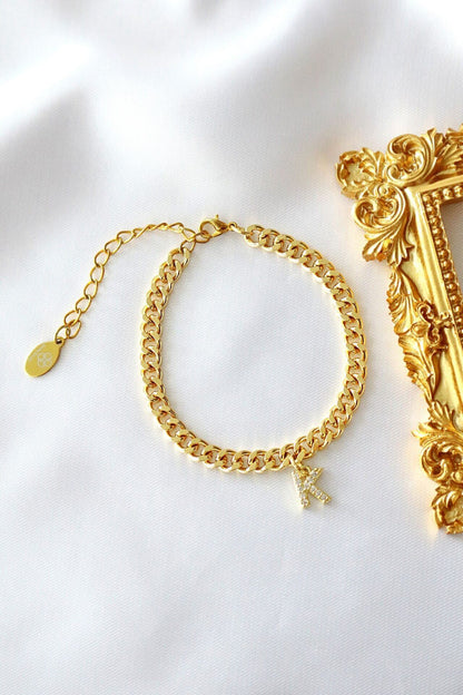 Ultramarine Birch Custom Initial 24K Gold Thick Cuban Chain Bracelet with personalized initial pendant, showcasing luxurious jewelry design.
