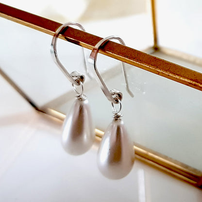 Maroon Smudge Dew Drop teardrop shell pearl earrings with elegant design and silver hooks, perfect for stylish accessories.