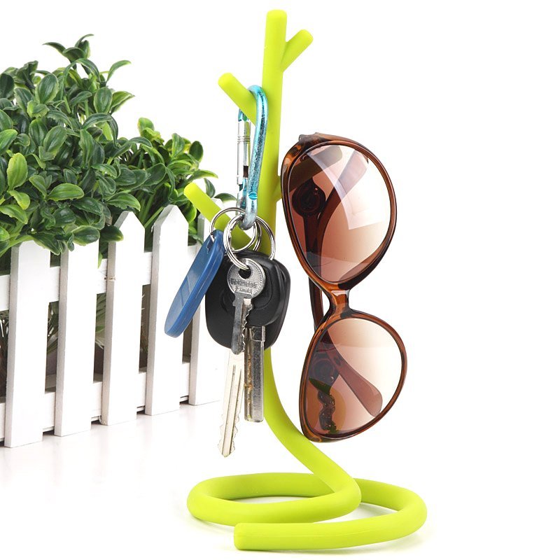 Fuchsia Molly deformable tree storage stand for home and garden, adjustable metal frame with wood base for outdoor or indoor use.