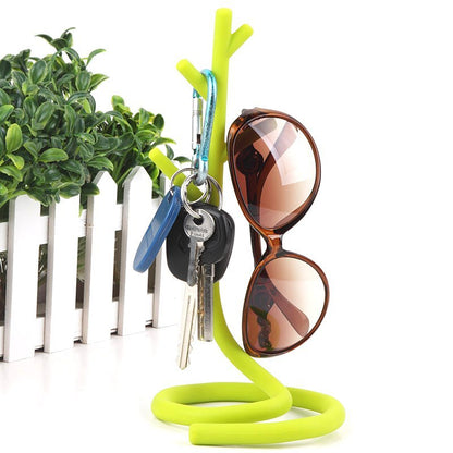 Fuchsia Molly deformable tree storage stand for home and garden, adjustable metal frame with wood base for outdoor or indoor use.