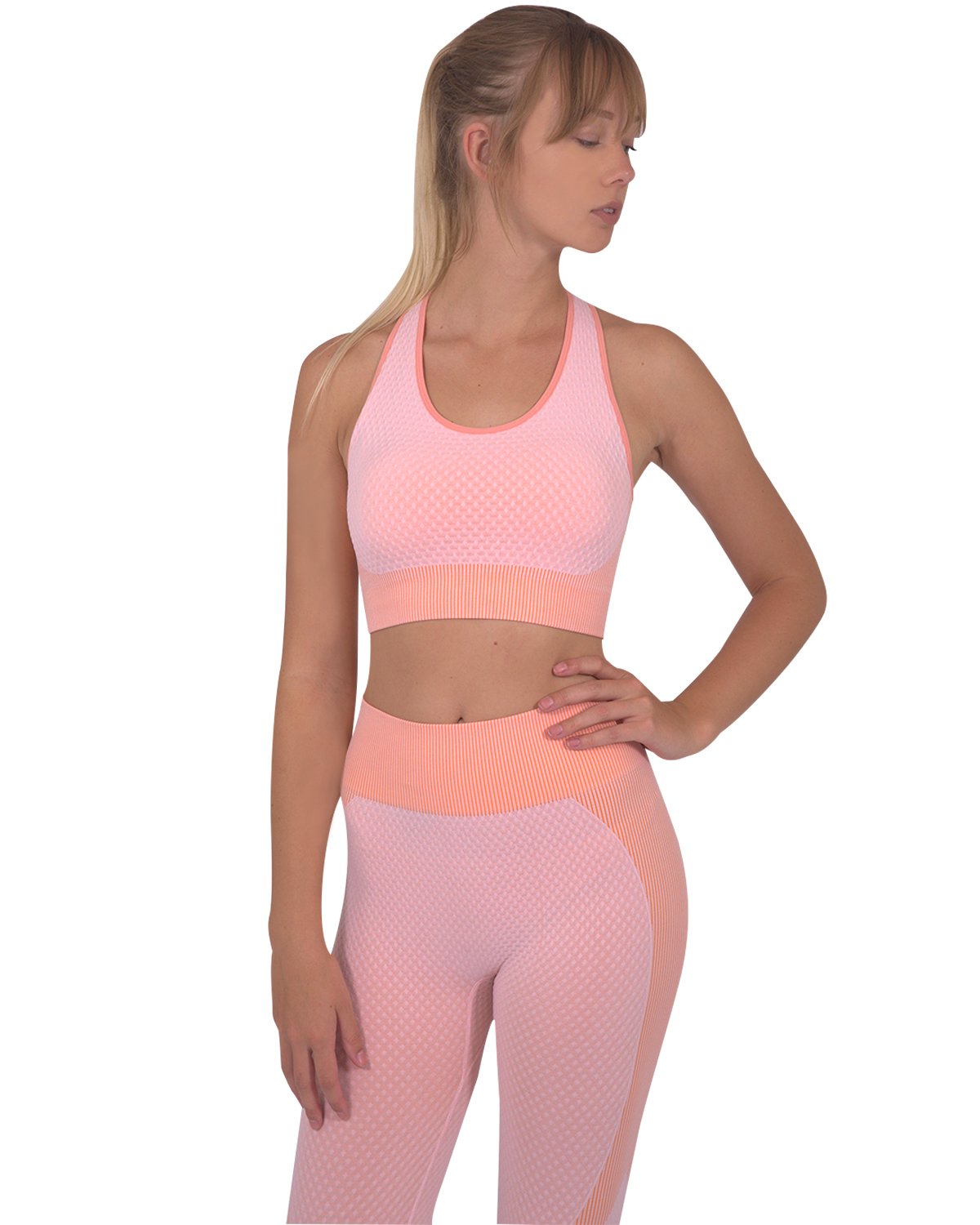 Lazurite Trois seamless pink activewear set with leggings and sports top, made of stretchy, comfortable fabric for exercise and casual wear.