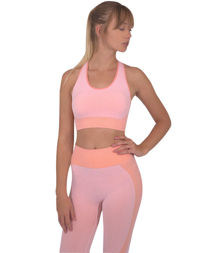 Lazurite Trois seamless pink activewear set with leggings and sports top, made of stretchy, comfortable fabric for exercise and casual wear.