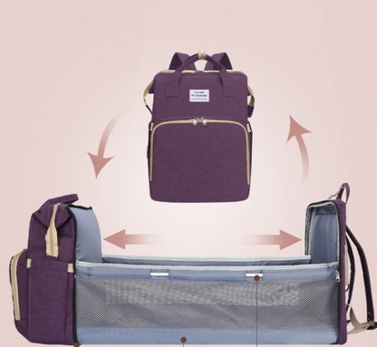 Carmine Juneberry ALLFASHION™ FoldAway BabyNest Backpack with adjustable straps and compact foldable design for easy carrying.